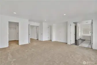 In the Primary bedroom: To the left is walk-in closet #1. To the right of the first walk-in closet is the double-door into the room, to the right of that is walk-in closet #2. There is also a media nook. Double doors into the private bathroom rivals any high-end hotel.