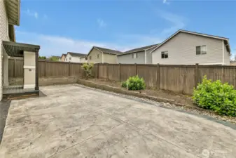 The poured concrete patio is great for scooters, skates, or a ton of sun chairs!