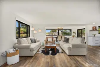 Big picture windows fill the home w/ natural light