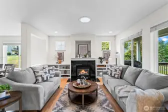 Lovely living area with built in bookshelves and gas fireplace