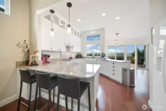 The charming eat-in kitchen welcomes you with a seamless flow.