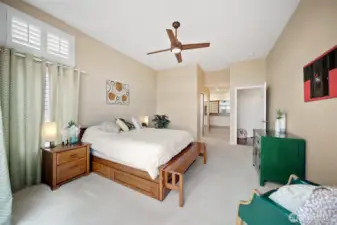 Another perspective of the primary bedroom highlights the seamless flow into a spacious walk-in closet on the left, guiding you into the luxurious primary bathroom.