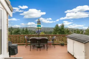 Multiple dining and lounging areas, along with ample storage, enhance the convenience of your serene back deck retreat.