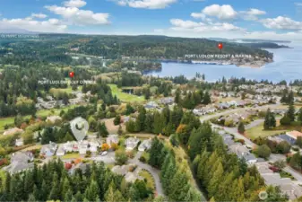Perched at an elevated vantage point, this view highlights the property's prime location near the golf course, Olympic Mountains, Ludlow Bay, and the resort and marina.  Welcome Home!