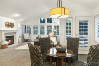 The dedicated dining area opens directly to the brand-new deck, graced by elegant, warm lighting fixtures.