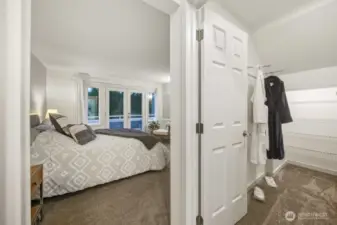 The primary suite includes a generous walk-in closet plus an additional closet (not pictured, located directly behind).