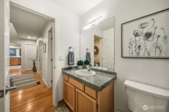 A convenient powder room on the main floor welcomes guests with effortless style and comfort.
