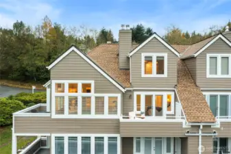 This sun-drenched upper condo unit, crowned with a brand-new roof, glows with natural light. From here, admire the elegant balcony flowing from the dining area, plus the serene primary bedroom balcony—both poised for breathtaking views and peaceful retreats.