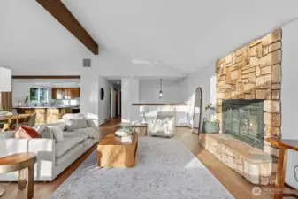 Floor to ceiling stone wood burning fireplace