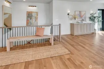 Designer art lighting is dramatic and anchors the stairway.  Residential elevator takes you, your groceries, your family to all 3 floors of this home.