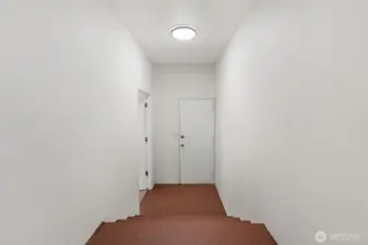 Access to back door with bedroom/office to the left