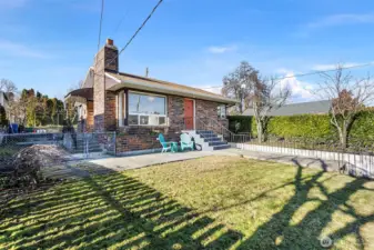 Set on a corner lot and slightly elevated above the street, this 1948 brick home offers privacy, natural light, and a reassuring sense of presence.