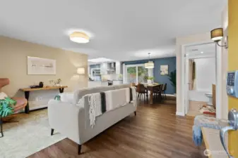 Bright and open living room flow to dining and kitchen.