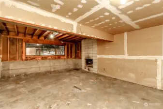 Daylight windows add natural light to this space. Restore the second fireplace and make this space cozy again.