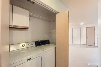 Laundry closet just off hallway.