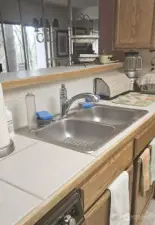 Double sinks and open to the living room.