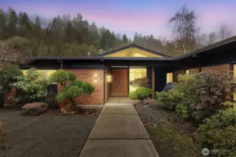 Breathtaking, one-of-a-kind mid-century home nestled along the riverfront!