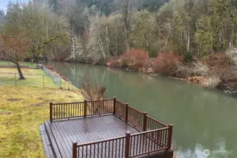 The generously sized deck is perfect for soaking in the stunning river views.