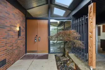 Front porch atrium brings an abundance of light to this timeless home.