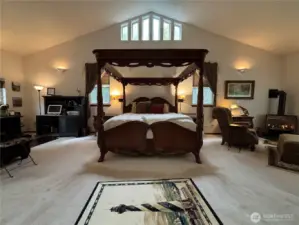 This primary suite is grand. The bed and some of the furniture can come with the home. Space for an office and sitting area.