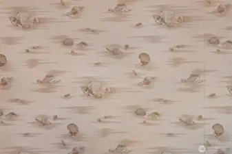 Every detail tells a story — even this seashell wallpaper, original to the home since 1995.