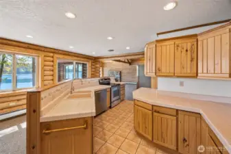 An open kitchen designed with function + comfort in mind, complete with an eat-in nook.
