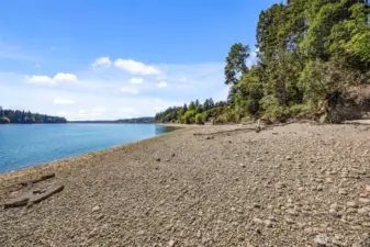 Endless water days await — 109 ft of low-bank waterfront and private beach access.
