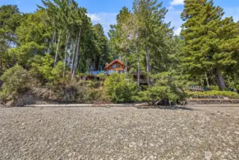 Waterfront living at its finest — 109 ft of low-bank shoreline with direct beach access.
