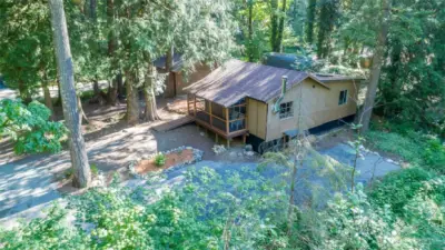 The home sits in a cozy setting in this riverfront community.