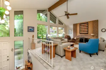 Inviting Entryway opens to soaring vaulted ceilings and large picture windows.