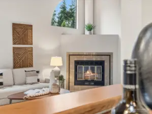 View from the kitchen into the living room fireplace