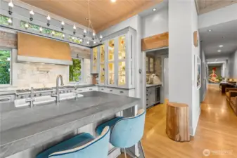 Butler's pantry with beverage bar leads to utility room entry.  Hallway to bedrooms.