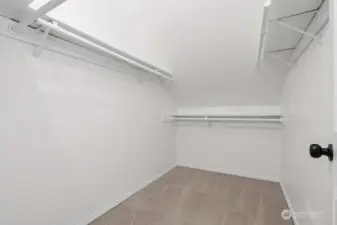 Large walk-in closet in primary bedroom suite