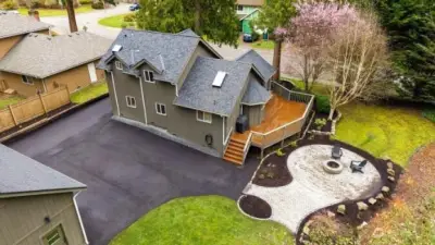 Aerial of home with new paved driveway, new fire pit & patio. This property is in excellent condition!