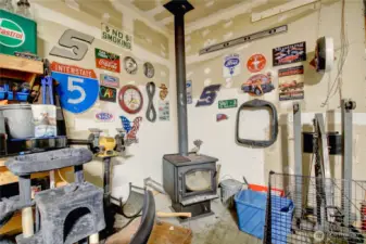 Wood burning free standing stove keeps shop warm