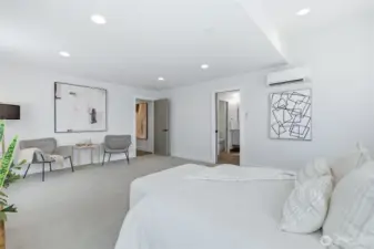 Primary retreat offers sitting area and newly remodeled bathroom.