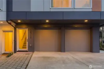 Rare side-by-side two car garage, storage room & EV car charging