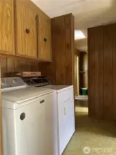 Washer and dryer is in bedroom hallway.