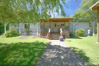 Entry to home with cover deck area.