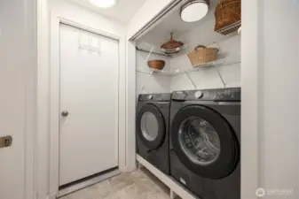 Laundry area is just off of the kitchen and near the door to the garage.