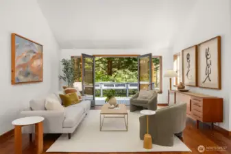Teak floors bring a touch of luxury to the spacious living room, adding warmth, durability, and a natural elegance that perfectly complements the relaxed Bainbridge Island lifestyle.