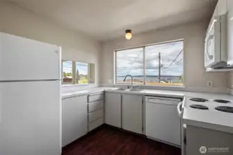 Kitchen appliances include dishwasher and microwave