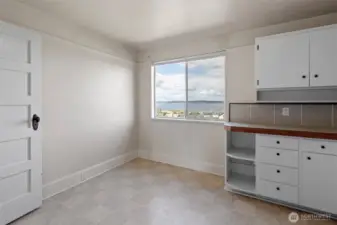 Upper unit kitchen with dining area