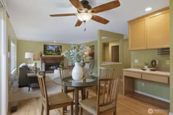 Informal eating space between the kitchen and family room with sliders to the backyard.