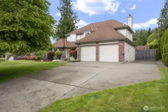 This angle shows the RV parking area next to the house.