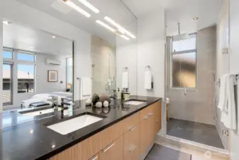 Primary bath features large, naturally lit dual-head shower