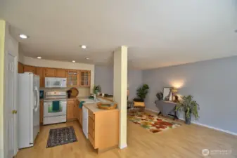 Enjoy family room activities while preparing meals.