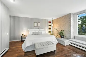 Generously sized Primary bedroom features premium placement for breathtaking, uninterrupted vistas of Puget Sound’s tranquil shoreline.