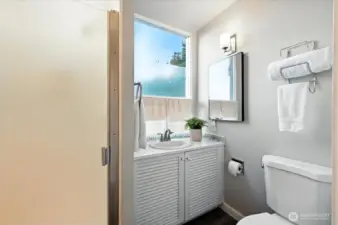 Shower on the second floor serves the primary and guest bedrooms.