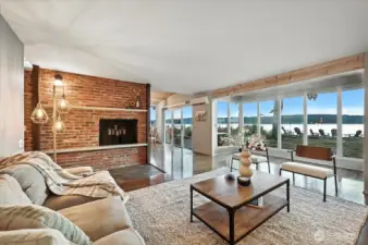 Enjoy the warmth and charm of a wood-burning fireplace in the spacious living room of this oceanfront retreat.